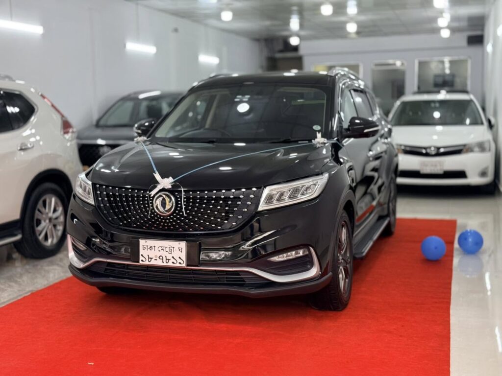 Black SUV displayed on a red carpet by Trusted Car Dealer Dhaka