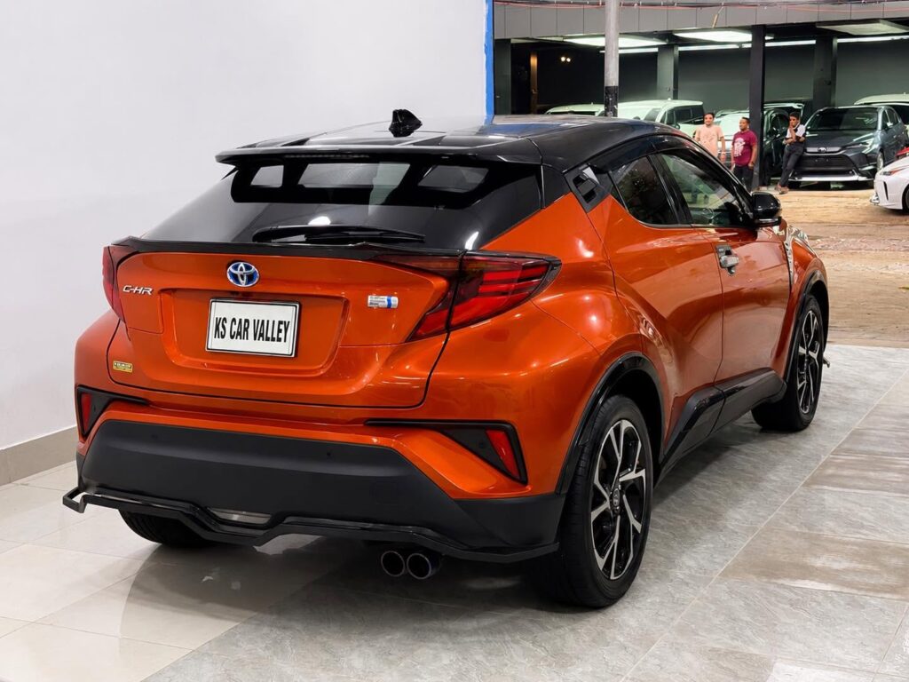 Rear view of an orange Toyota C-HR, Second Hand Car For Sale in Tejgaon