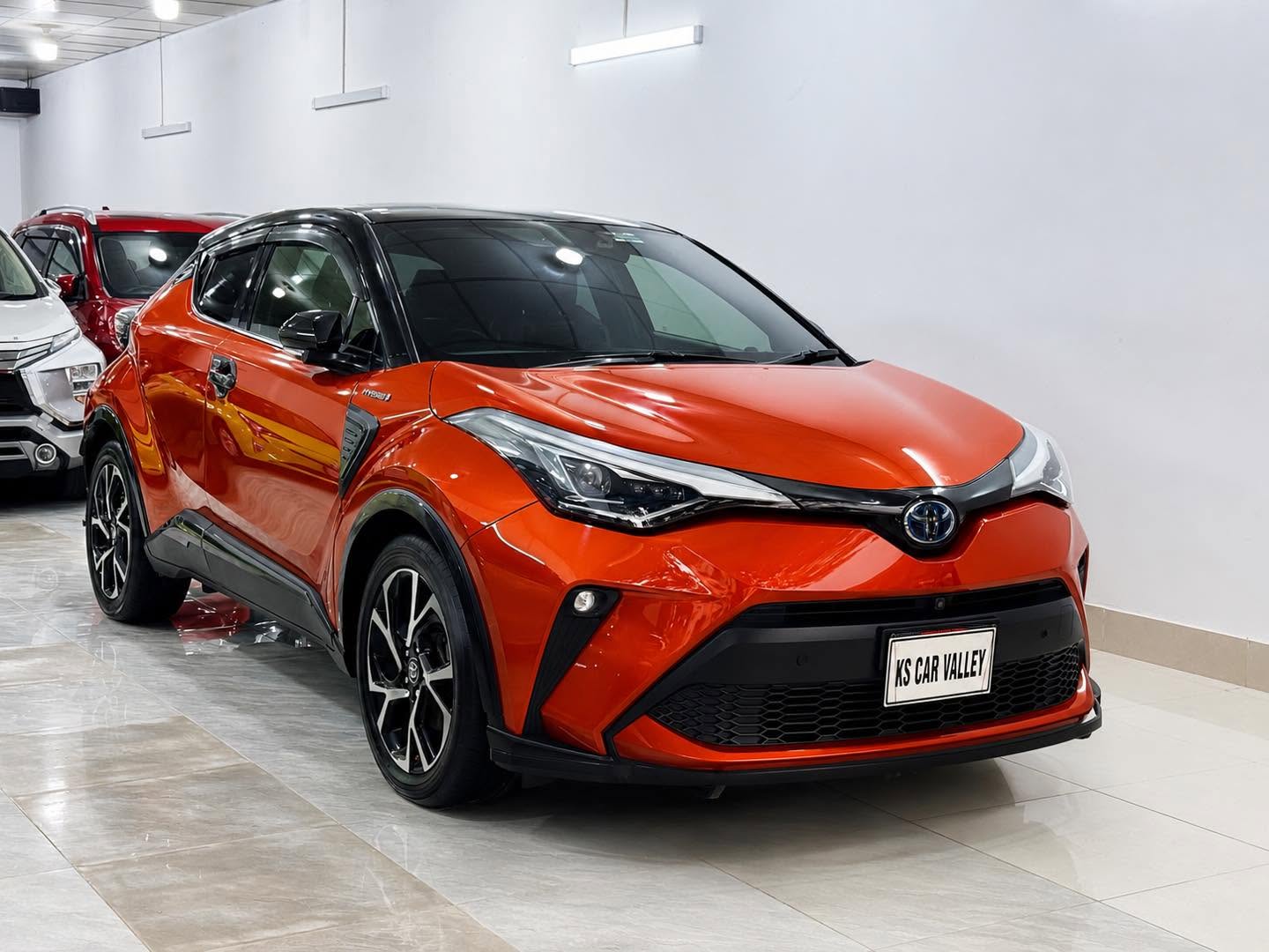 Front view of an orange Toyota C-HR, Second Hand Car For Sale in Tejgaon