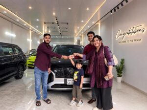 Best Used Car Showroom customer handover at KS Car Valley with happy family and new car