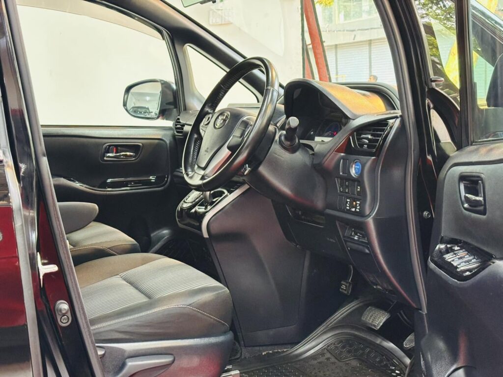 Used Car For Sale with clean Toyota interior, steering wheel, dashboard and front seats
